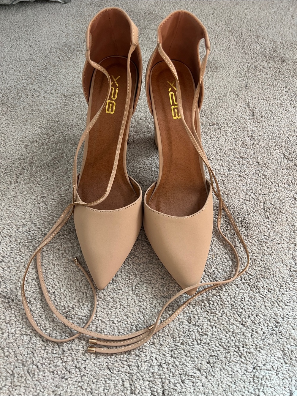 Never worn ankle tie tan heels. Size 10